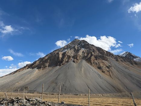 Majestic view of a mountain peak in Marango Rangarik, Himachal Pradesh, India under a blue sky.