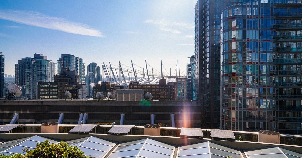 Stunning view of Vancouver skyline with modern architecture and BC Place in daylight.