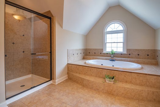 Spacious modern bathroom featuring a luxurious bathtub and glass-enclosed shower.