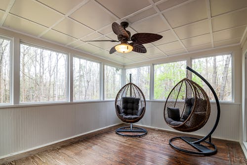 Ceiling Fan and Egg Chairs inside a Room