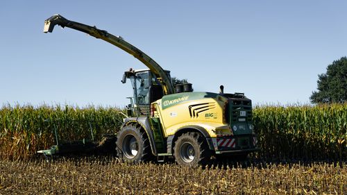 Free A powerful harvesting machine in action in a corn field during autumn in Lütau, Germany. Stock Photo