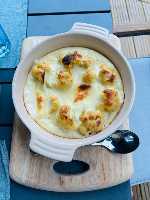 Free A tasty baked cauliflower dish with rich cheese sauce, perfect for dinner. Stock Photo