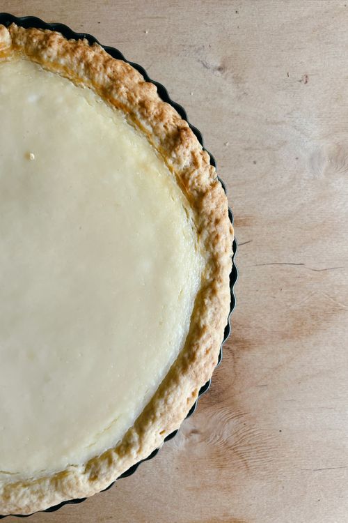 Free Freshly baked pie with golden crust on a wooden surface, inviting and delicious. Stock Photo