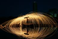Glowing freeze light twining wooden stick in dusk