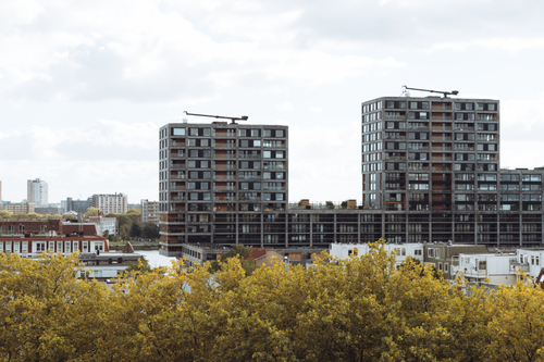 Free A panoramic view of modern buildings in Rotterdam, Netherlands, showcasing urban architecture and autumn foliage. Stock Photo