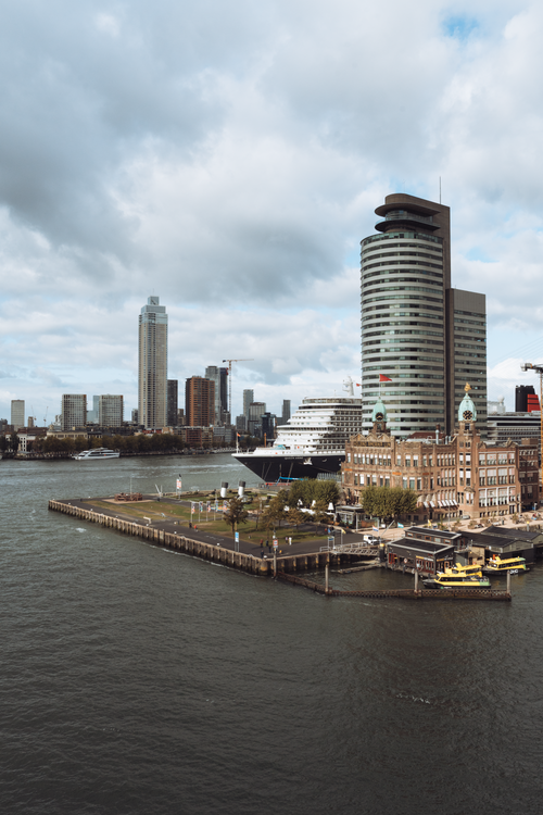 Free Aerial view of Rotterdam's skyline showcasing modern architecture along the waterfront. Stock Photo