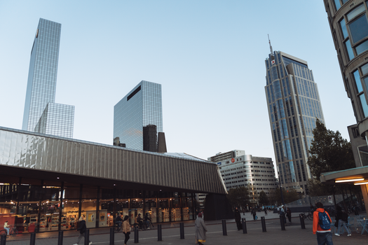 Explore modern architecture and skyscrapers in Rotterdam cityscape.