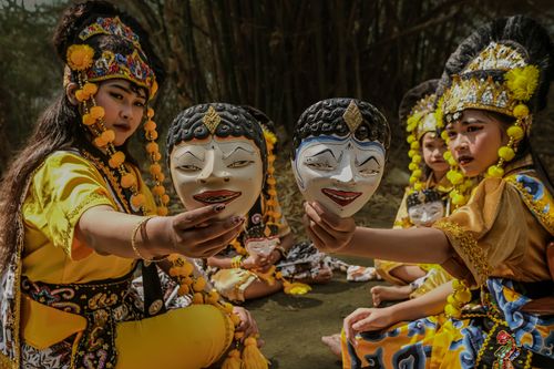 Free Indonesian dancers in vibrant costumes and masks depicting cultural narratives in Bandung, West Java. Stock Photo