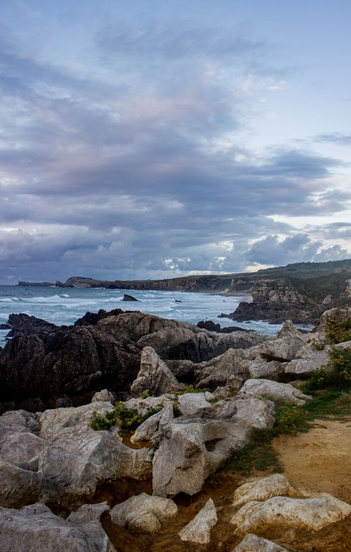 Free Dramatic cliffs and ocean waves along the Cantabrian coast during daytime. Stock Photo