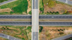 Road connection near green trees in suburb