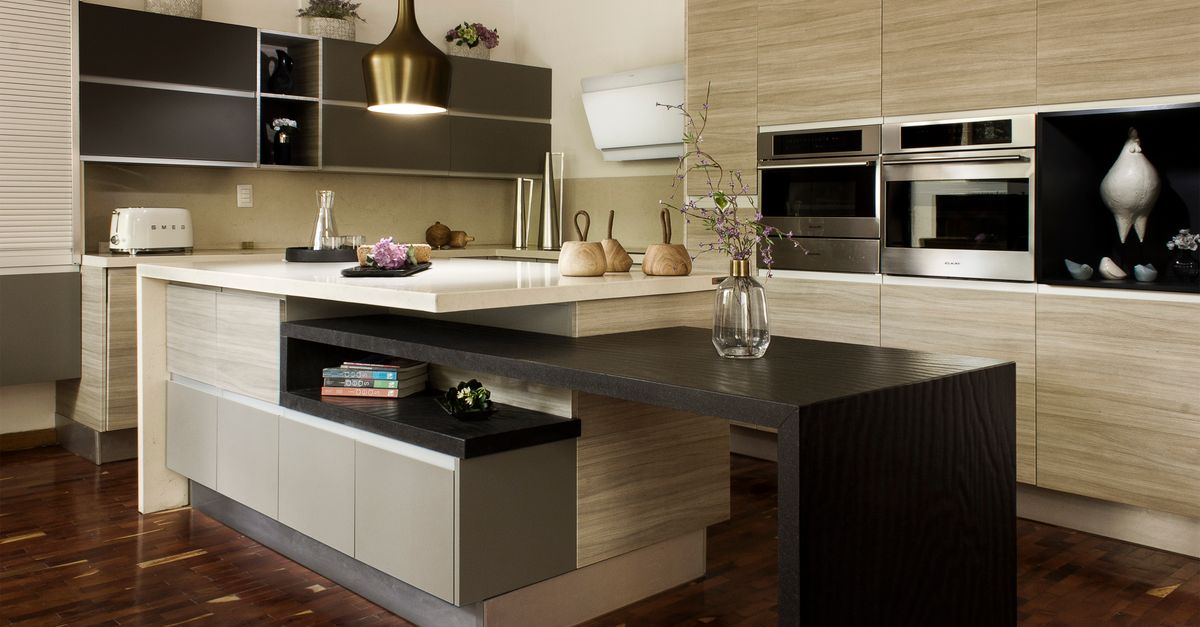 Modern kitchen with wood grain cabinets and multi-level island
