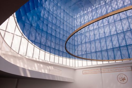 Free Contemporary dome with blue glass panels and Arabic calligraphy, Slovenia architecture. Stock Photo