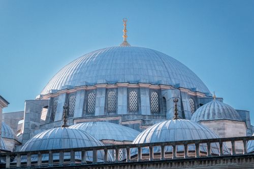 Free The majestic domes of Suleymaniye Mosque under a clear blue sky in Istanbul, Türkiye. Stock Photo