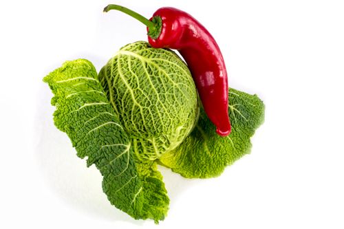 Free High-quality image of fresh savoy cabbage and a red chili pepper, perfect for culinary themes. Stock Photo