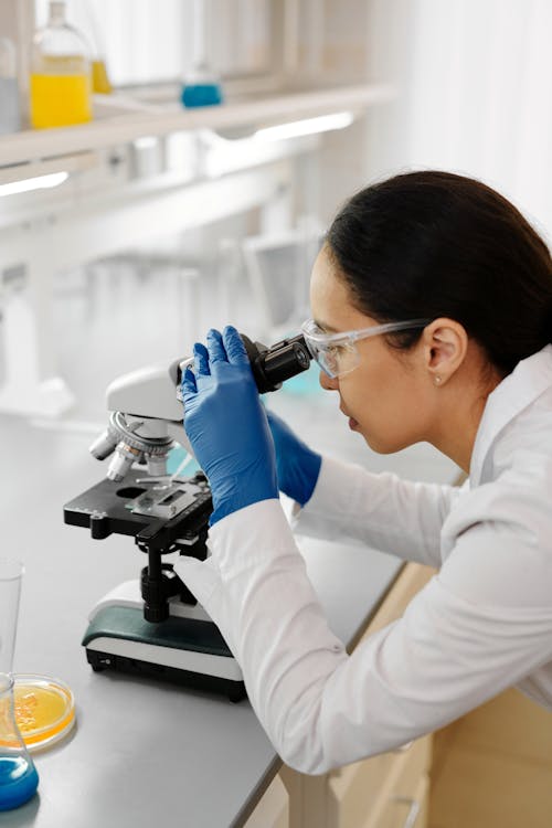 Scientist Working with Microscope