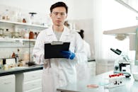 Male Scientist in White Lab Coat Working in a Laboratory