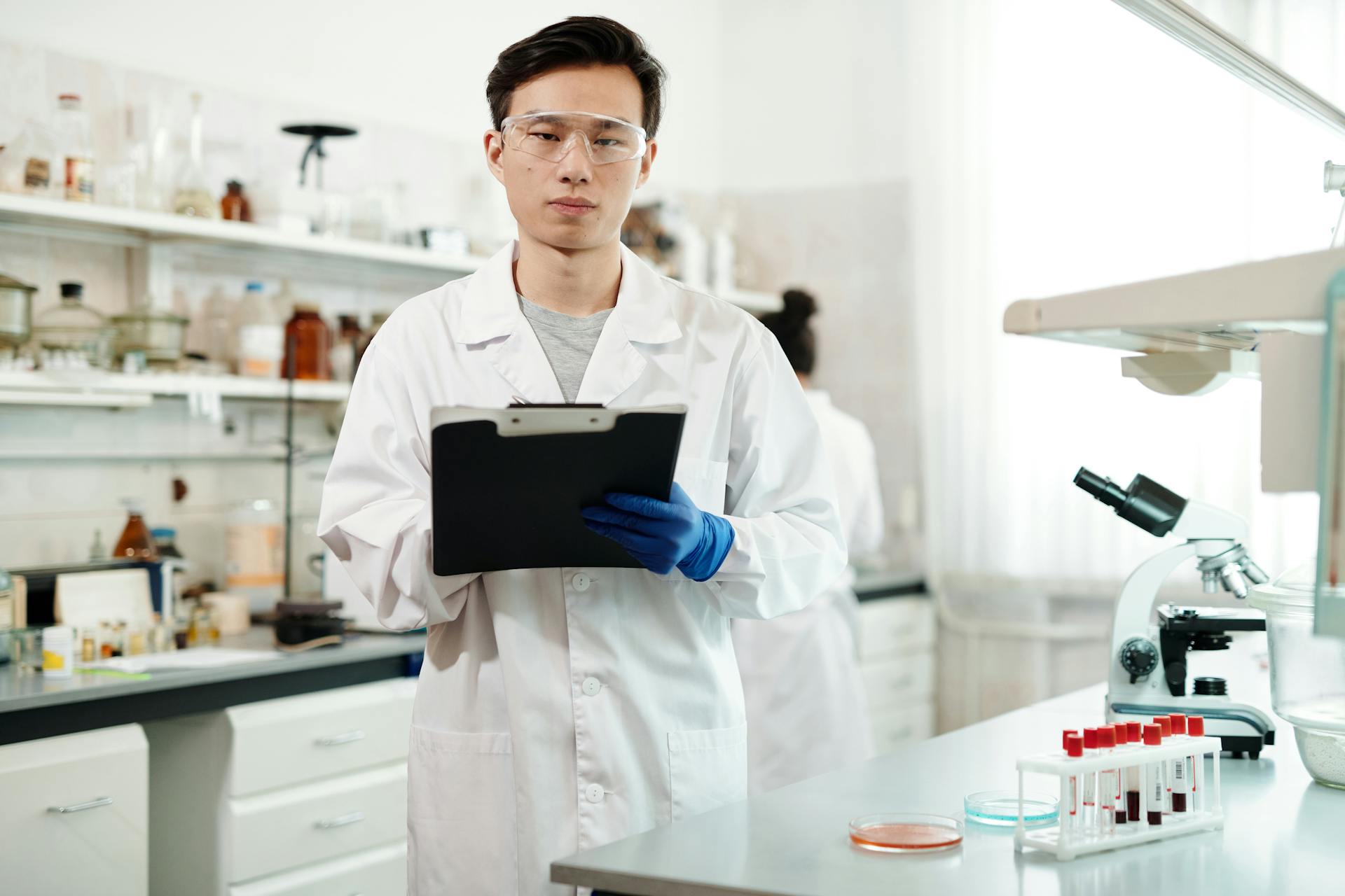 Male Scientist in White Lab Coat Working in a Laboratory