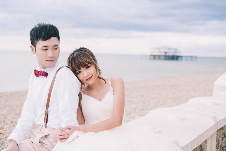 Happy Newlywed Ethnic Couple Embracing On Sandy Beach