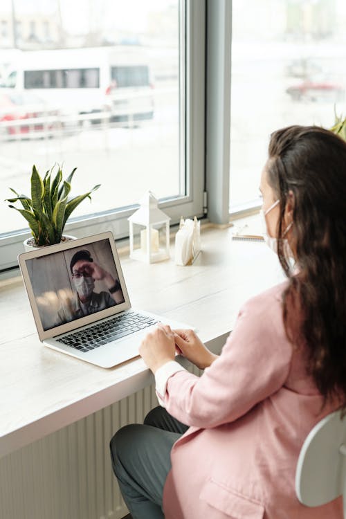 Free Woman Using Her Laptop On Video Call Stock Photo
