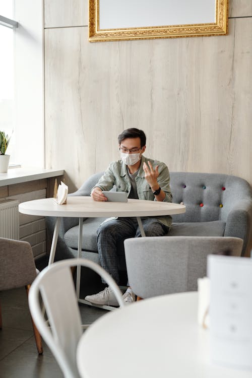 Free Man Having A Video Chat While In Isolation Stock Photo