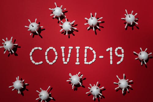 Free Concept Of Covid-19 In Red Background Stock Photo
