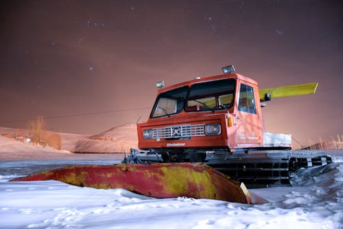 Free A Snow Plow Truck under the Night Sky Stock Photo