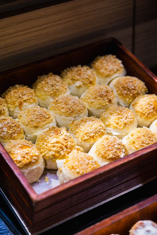 Free Delicious coconut almond pastries with a golden crust, perfect for dessert or breakfast. Stock Photo