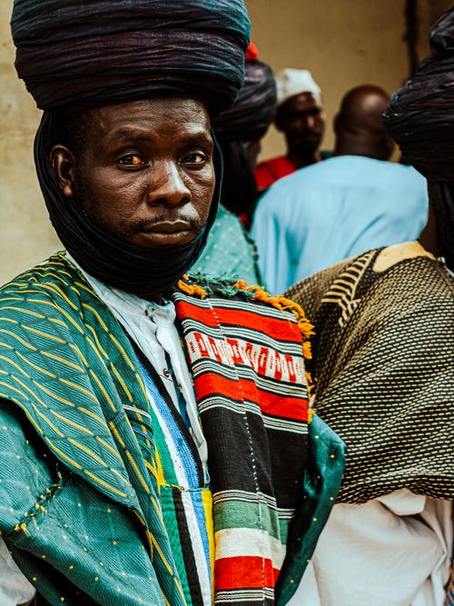 Free Hausa man in vibrant traditional attire during a cultural event in Jigawa, Nigeria. Stock Photo