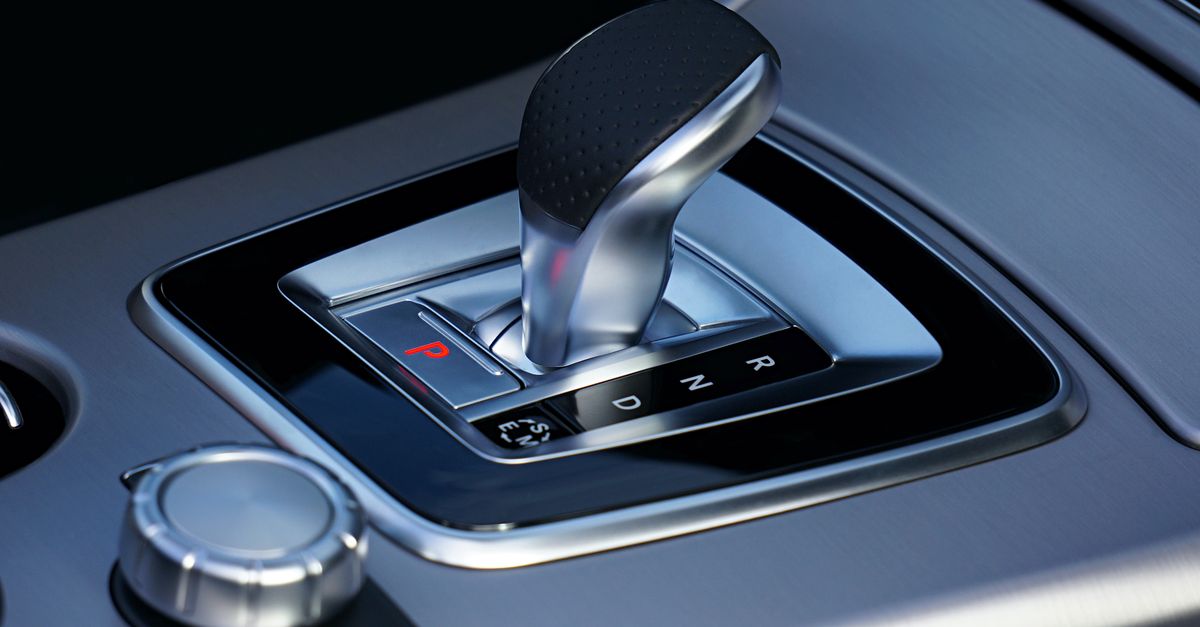 Detailed view of a sleek automatic gear shift in a luxury vehicle, emphasizing modern design.