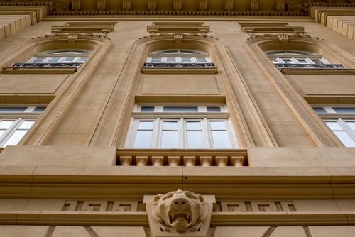 Free Detailed view of a classic building facade in Belo Horizonte, showcasing intricate stonework and ornate windows. Stock Photo