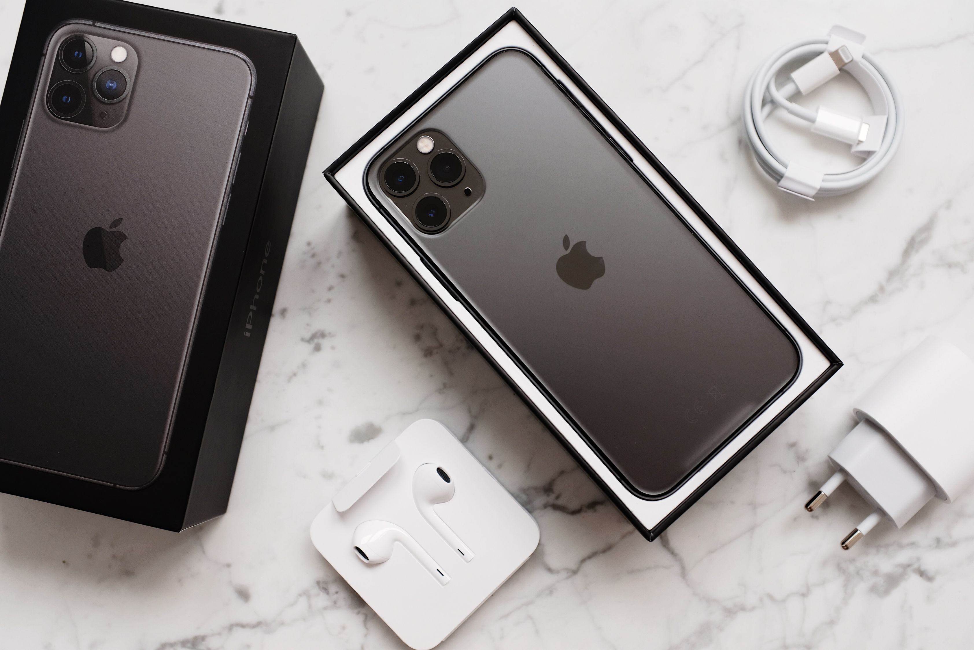 Arrangement of black smartphone in box with devices · Free Stock Photo
