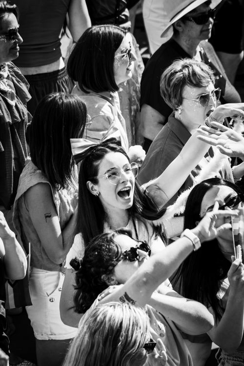 Free Black and white photo capturing a lively crowd enjoying an outdoor event in Amsterdam. Stock Photo