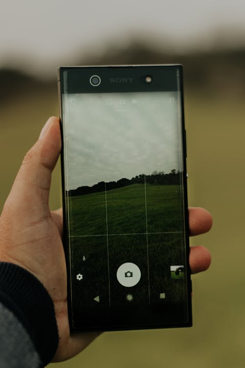 Person Holding Black Android Smartphone