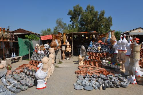 Free Explore diverse handcrafted pottery at a vibrant outdoor market in Taxila, showcasing cultural artistry. Stock Photo
