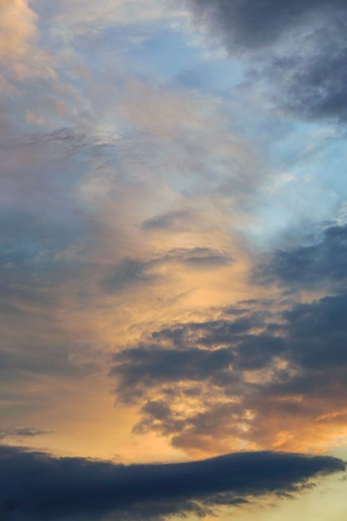 Free Colorful sunset sky featuring vivid clouds in a breathtaking display. Stock Photo