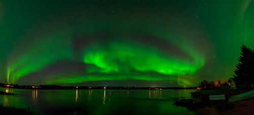 Free Stunning view of Aurora Borealis painting the night sky green over Keminmaa, Finland. Stock Photo