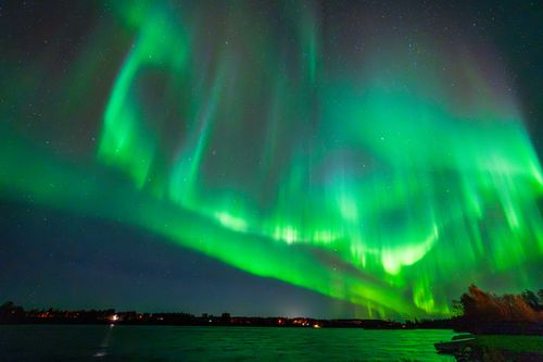 Free Captivating view of Northern Lights illuminating the night sky over Keminmaa, Finland. Stock Photo