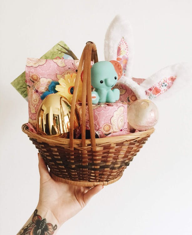 White and Pink Rabbit Figurine on Brown Woven Basket · Free Stock Photo