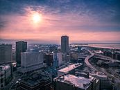 Cityscape of megapolis on seashore at sundown