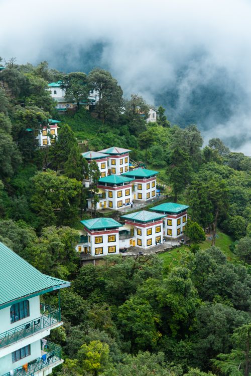 Free Beautiful hillside view in Mussoorie, India, showcasing colorful houses surrounded by lush greenery. Stock Photo