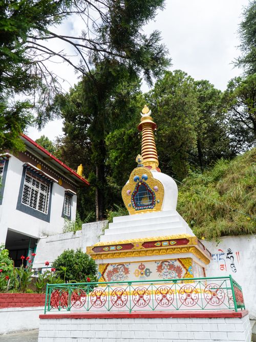 Free Beautiful Buddhist stupa surrounded by lush greenery in Mussoorie, Uttarakhand, India. Stock Photo