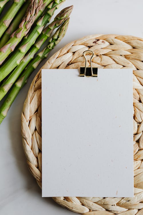 Free Asparagus And Blank Paper On A Mat Stock Photo