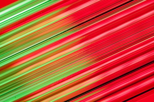 Free Stunning abstract design with vibrant red and green light trails creating a futuristic feel. Stock Photo