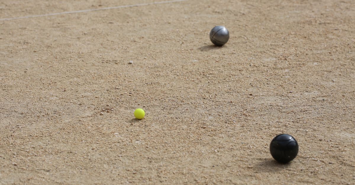 Bocce balls on a sandy court in Marseille, France, capturing a classic recreational sport scene.