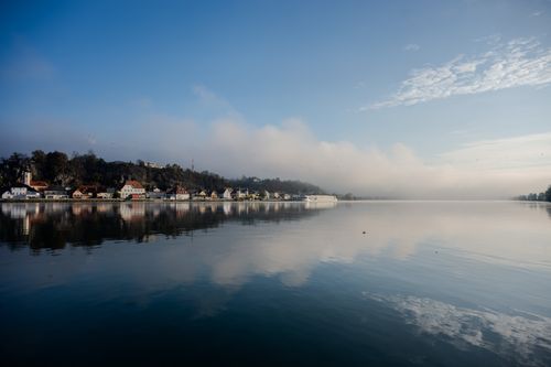 Free Idyllic misty morning view of the Danube River and quaint architecture in Austria. Stock Photo