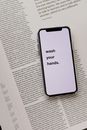 Opened book with smartphone with warning message