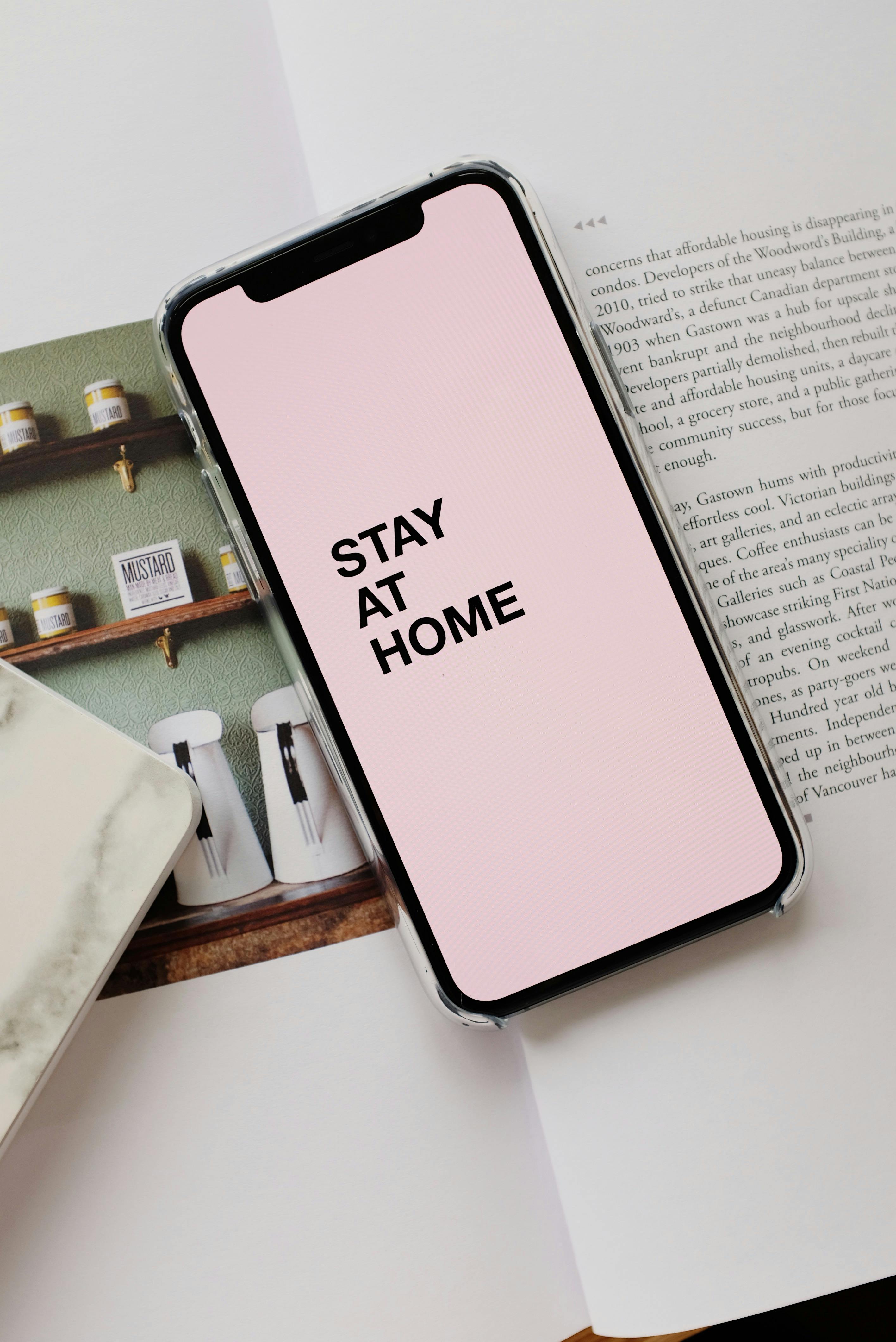 smartphone screen with stay at home inscription