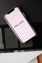 Smartphone with STAY SAFE title on open magazine