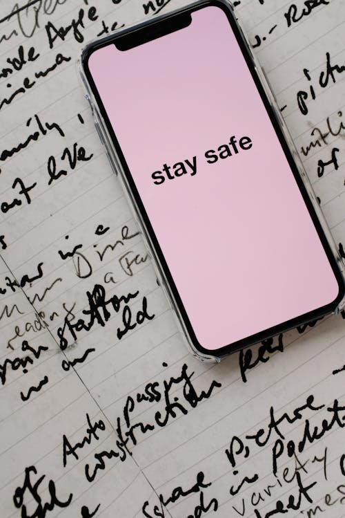 Free Smartphone With Stay Safe Note On Screen Stock Photo