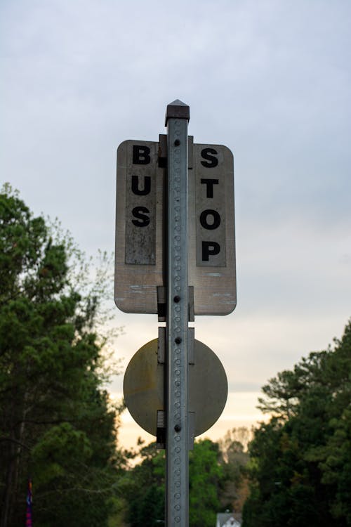 Gray and Black Bus Stop Sign